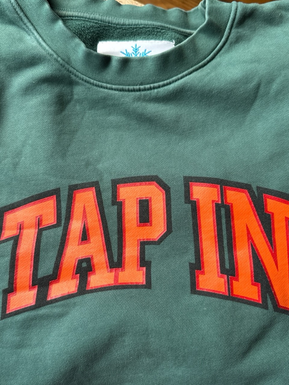 Green Crewneck Sweatshirt with Bold Orange Lettering